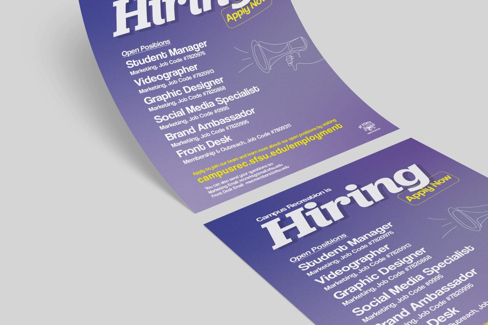 Two printed copies of the Campus Recreation hiring flyer lying on a grey surface.
